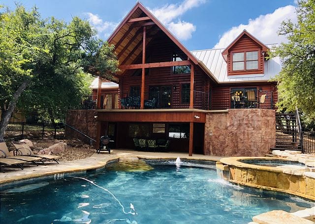 Cowboy’s Cove - cabin exterior, outdoor pool, hot tub.