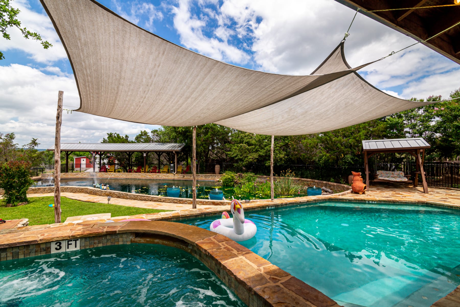 Coyote Moon Lodge - outdoor pool and hot tub overlooking koi pond